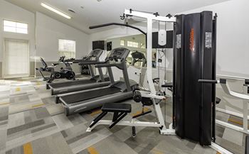 A gym with treadmills and exercise equipment.at Sunset Ridge, West Jordan, UT 84081
